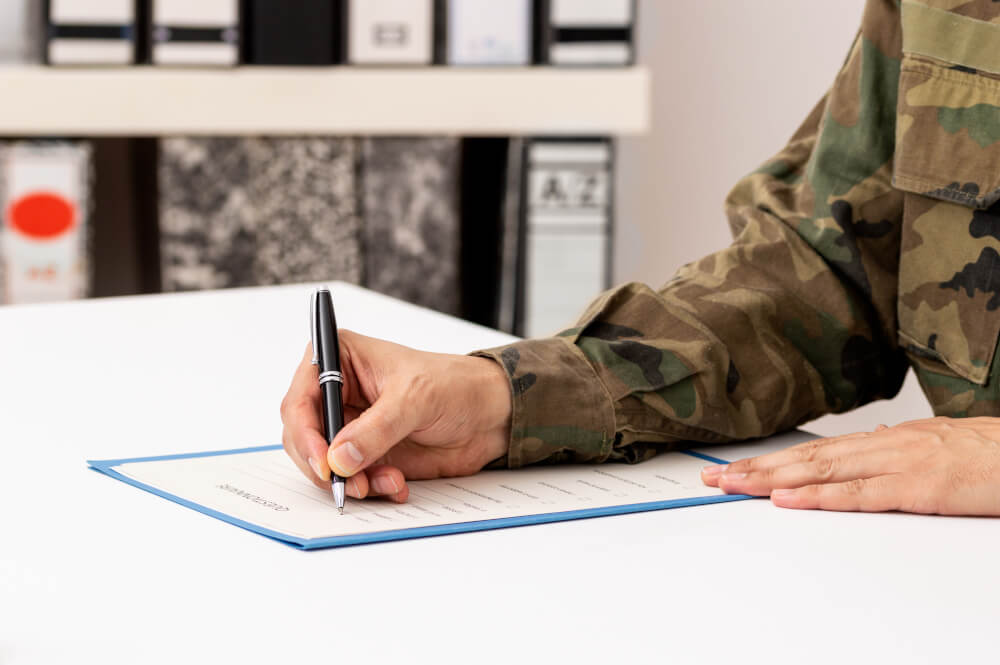 Service member filling out paperwork